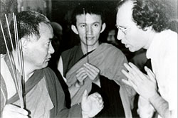 Lama Yeshe ‘instructs’ Jon Landaw while Gonsar Rinpoche looks on.
