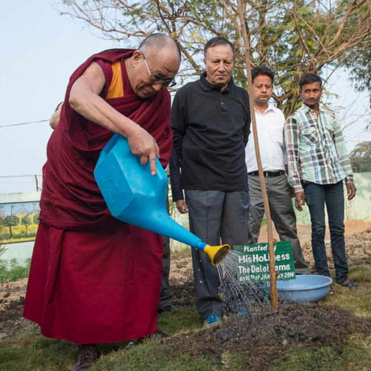 His Holiness the Dalai Lama planting a tree